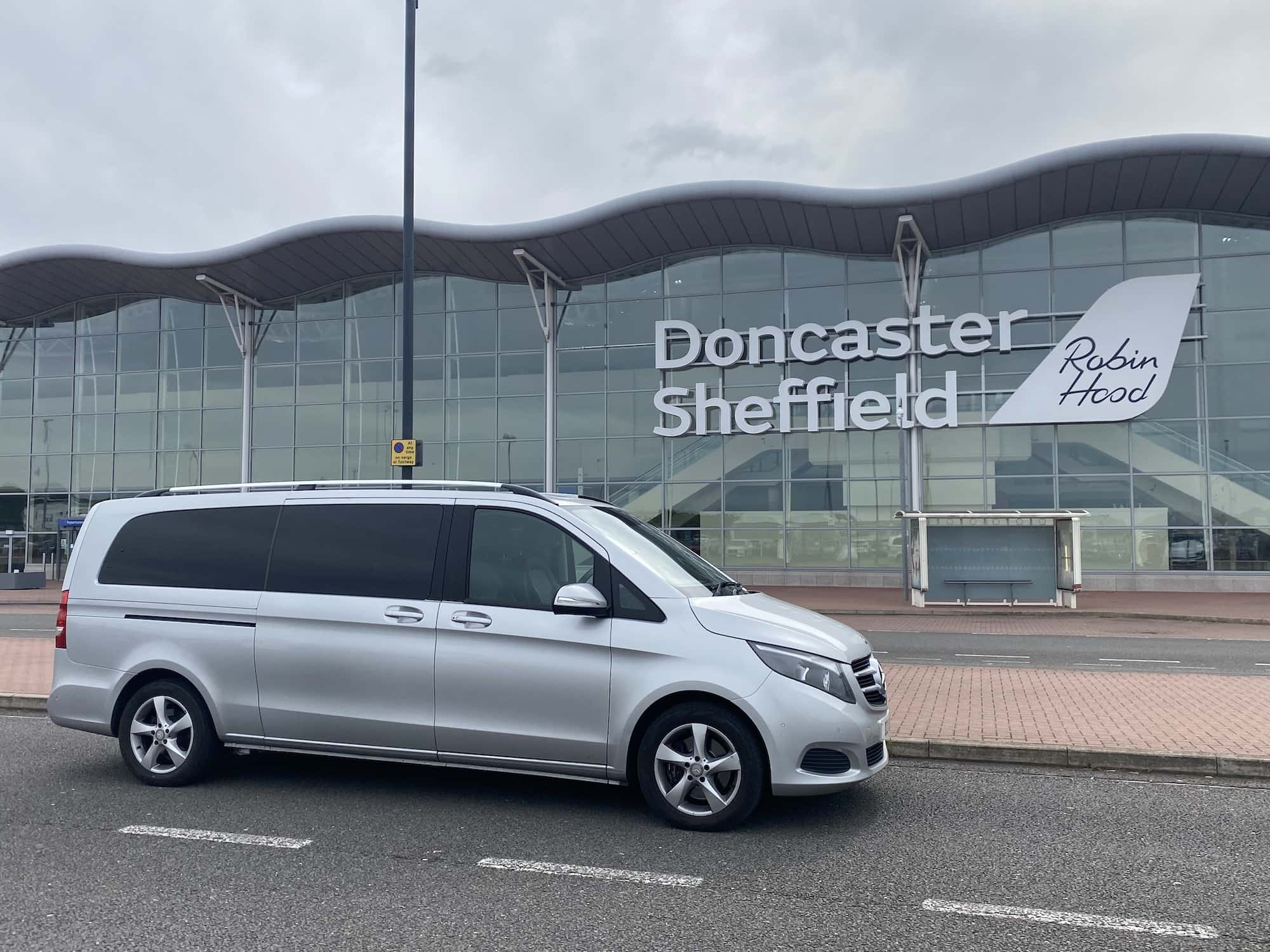 Mercedes V Class dropping airport transfer clients from Derby to Doncaster Airport