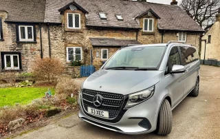 Luxury chauffeur vehicle visiting a traditional Peak District village during a guided Derbyshire tour