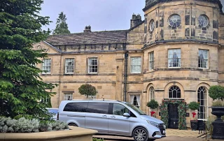 Mercedes V-Class chauffeur vehicle arriving at a Derbyshire country house hotel