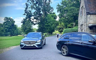 Executive Mercedes chauffeur vehicles at a Derbyshire country estate