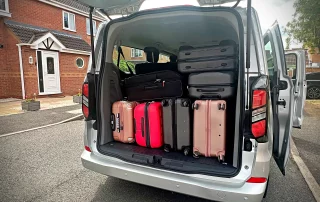 Ford Tourneo Custom luggage capacity for airport transfers with multiple suitcases