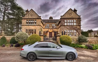 Mercedes S-Class chauffeur vehicle collecting guests from a Derbyshire hotel