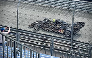 Single-seater racing car competing at a motor racing event